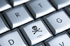 Online piracy (skull and crossbones on keyboard)
